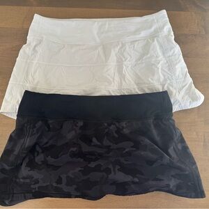 Lululemon 2 pair of women’s shorts size 8, lined. 1 Black camo and 1 White.